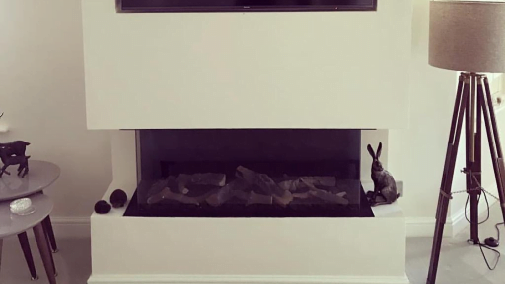 Gas media wall installation with modern fire in Cheshire home